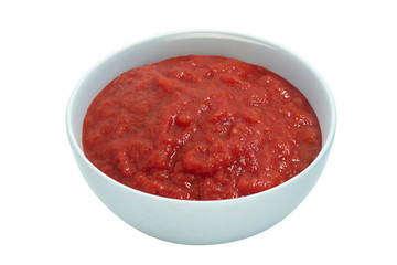 Raw tomato sauce in a white cup isolated on white background