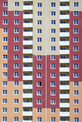 Kiev, Ukraine - June 10, 2017: Texture and background with building and windows. The facade of a new multi-storey building. A new-build multi-storey housing estate