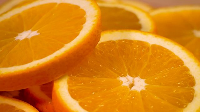 Marco shot of orange fruit and rotate.Close up flesh citrus orange. Nature background.