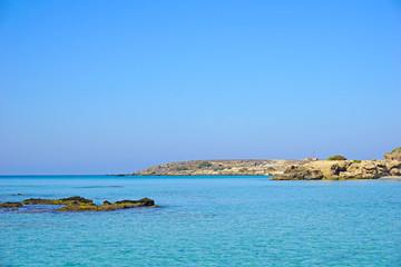 Amazingly clear blue water on the shore in Elafonisi on the island of Crete, Greece.