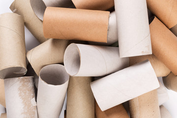 Cardboards sleeve from rolls of toilet paper. Out of toilet paper. Recycled cardboard cylinders from toilet paper. Close-up of empty toilet rolls.