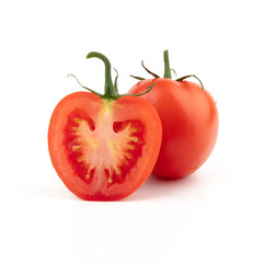 Red tomato in a cut and whole. Isolated on a white background. 