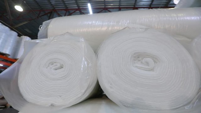 Sintepon warehouse at the factory, a large number of sintepon rolls in the warehouse