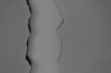 Gray and black torn paper lists, monochrome textural flat lay background