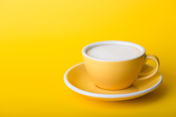 yellow cup on a yellow background