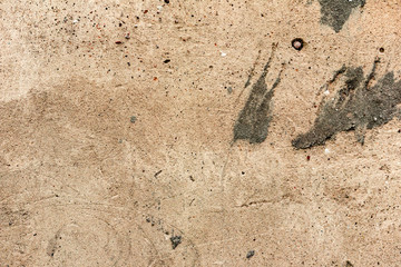 Texture of a concrete wall with cracks and scratches which can be used as a background