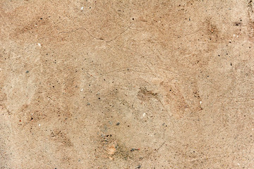 Texture of a concrete wall with cracks and scratches which can be used as a background