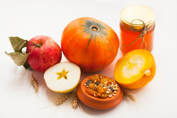 Fresh sliced pumpkin(squash), apples, glass jar of honey isolated on white background. Food, Thanksgiving day concept. Top view. Space for a text. Flat lay. Close up.