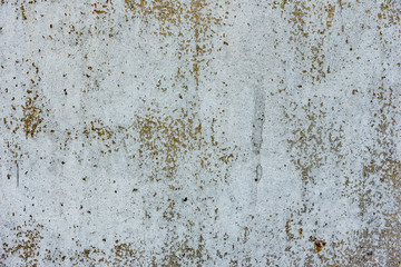 Texture of a concrete wall with cracks and scratches which can be used as a background