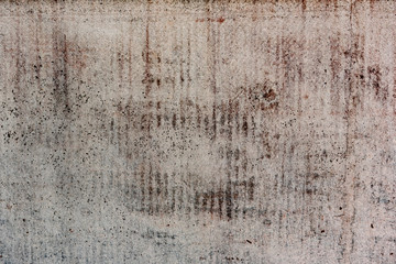 Texture of a concrete wall with cracks and scratches which can be used as a background