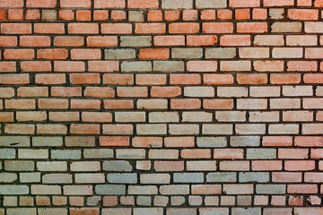 Texture of a brick wall with cracks and scratches which can be used as a background