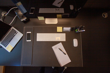 Office desk with paper and pen.
