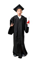 Full body of Little boy graduating makes funny and crazy face emotion on isolated white background
