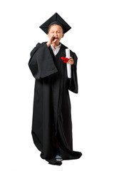 Full body of Little boy graduating shouting with mouth wide open on isolated white background