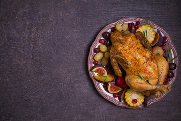 Whole roast chicken or turkey with fruits, vegetables and berries. Overhead, horizontal. Room for text, copy space