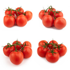 Red tomatoes whole set on a green branch. Isolated on a white background.