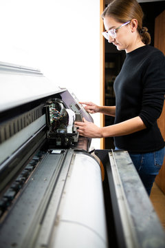Printing house, service of the printing process. Printing plotter support, the printer operates the machine