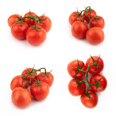 Red tomatoes whole set on a green branch. Isolated on a white background.