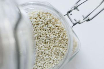 Raw white chia seeds in jar , macro