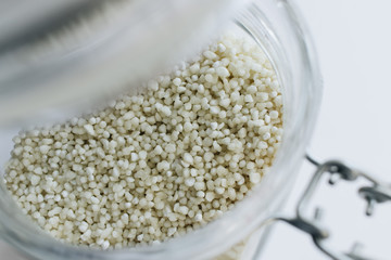 Raw white chia seeds in jar , macro