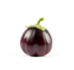 whole round purple fresh eggplant with green base isolated on white background