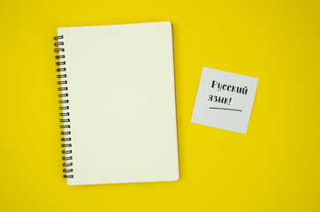 Flat lay empty notebook on yellow background