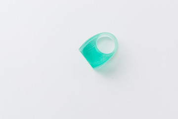 Modern style plastic ring on grey background