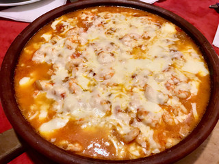 Homemade Shrimp Stew Casserole with Melted Cheese.