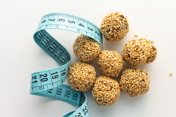 Healthy homemade cookies with nuts and sesame on white background