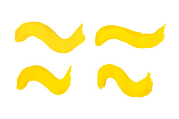Four different wavy yellow brush strokes