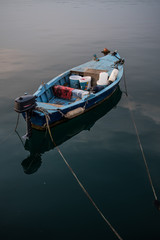 Old Wooden Fisher Boat On Calm Water In Harbor