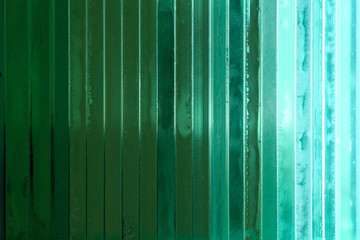 Green thick glass background. Abstract background, glass texture.