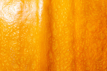 Ripe fresh pumpkin closeup, background . Yellow orange pumpkin. Pumpkin skin texture