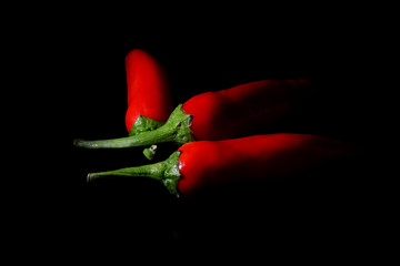red hot chili pepper on black background