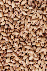 Background of inshell pistachios nuts closeup
