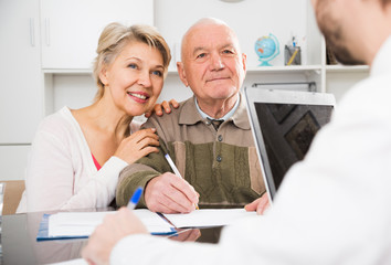 Old man and woman in social department