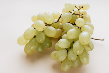 Pile of fresh green grapes on white background