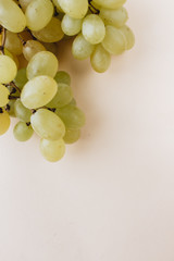 Pile of fresh green grapes on white background