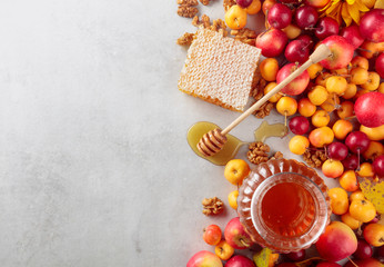 Red and yellow crab apples with honey and walnuts, healthy organic food.