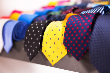 ties on hangers in men clothing store