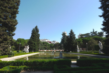 Public garden and the Royal Palace in Madrid in a beautiful summer day, Spain