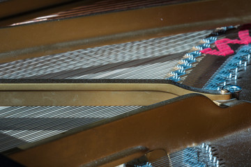 Inside the piano, musical instrument. Close up.