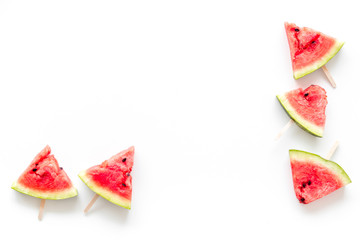 Slices of watermelon popsicle on white background top view mock up