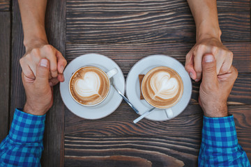 Young couple in love drinking coffee on dating