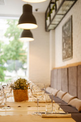 served table in a cafe, empty glasses, interior