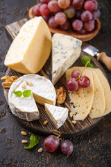 Cheese with nuts and grapes