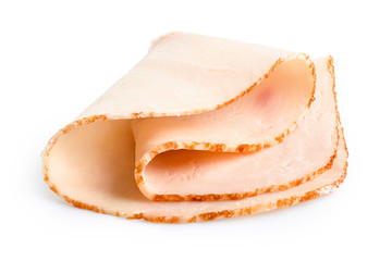 A folded single slice of chicken ham isolated on white.