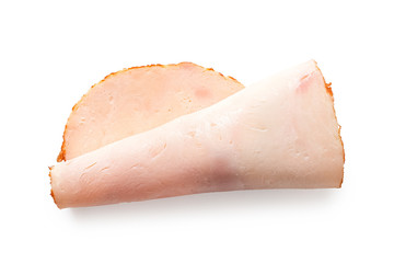 A folded single slice of chicken ham isolated on white. Top view.