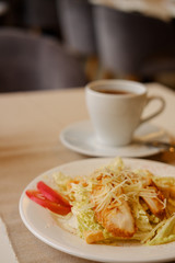 caesar salad with chicken and lettuce.