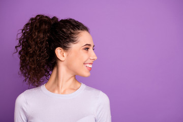 Close-up profile side view portrait of her she nice attractive cheerful cheery glad wavy-haired girl wearing white t-shirt looking aside isolated over violet lilac purple pastel color background